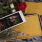 Dijon Yellow velvet wedding album and matching parent album with engraved covers, styled with roses and lavender