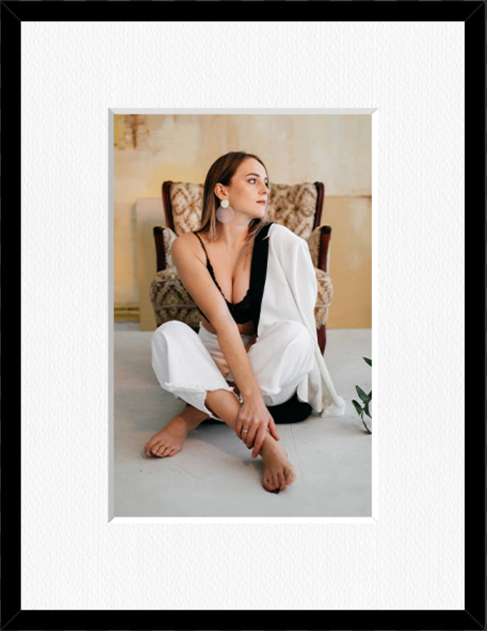 Portrait framed photo print in a black frame with a white mount