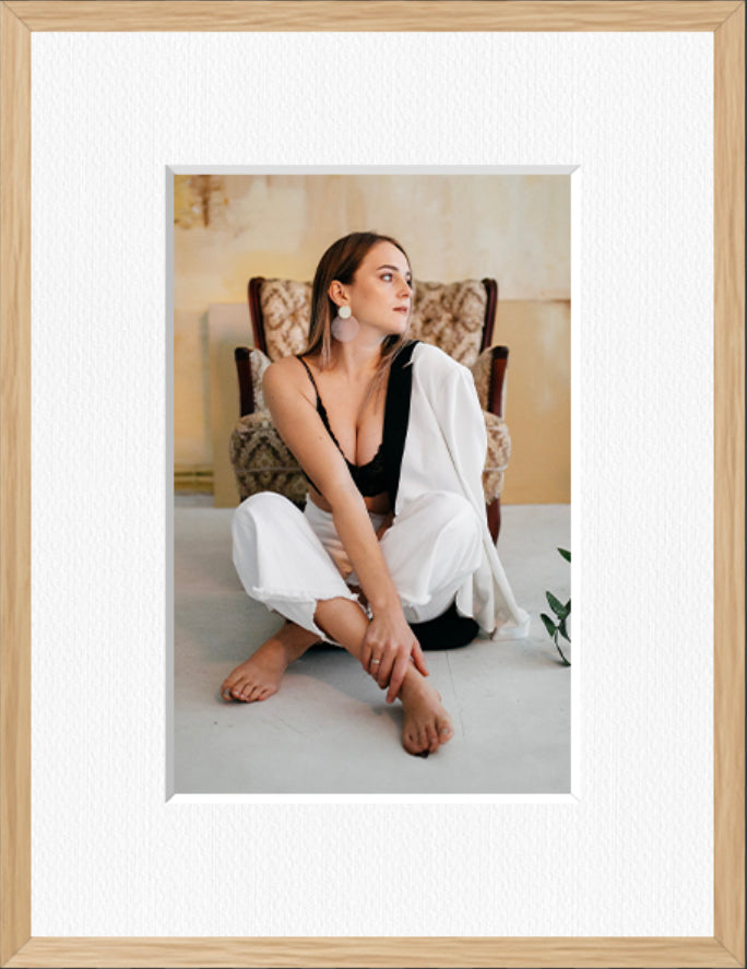 Portrait framed photo print in a natural oak frame with a white mount