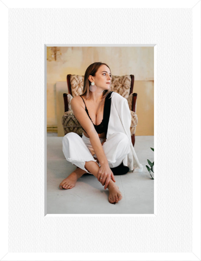 Portrait framed photo print in a white frame with a white mount